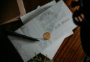 Airmail envelopes and a pen on a desk
