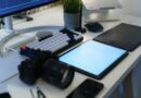 Camera, keyboard and drawing tablet on a desk