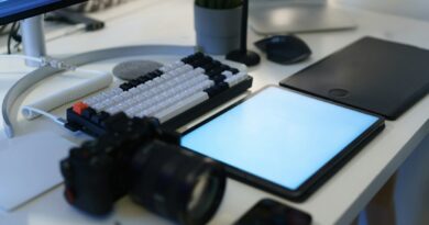 Camera, keyboard and drawing tablet on a desk