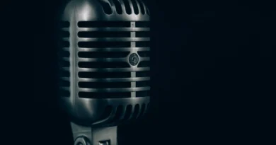 A vintage microphone against a dark background