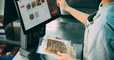 A customer selecting food on a self-service touchscreen